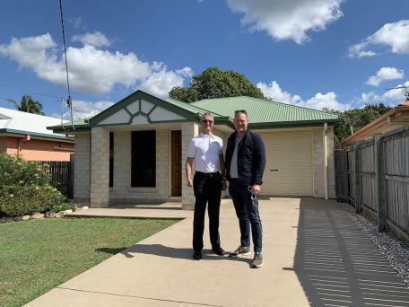 Buyer's Agent Sam Price standing with a client out the front of a tenanted property he purchased after undertaking due diligence to review the key documents to review before buying.