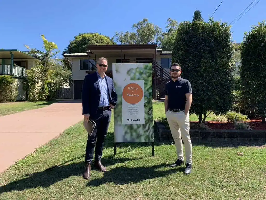 Buyer's Agent Sam Price standing in front of a house he assisted in purchasing for an interstate client for investment purposes