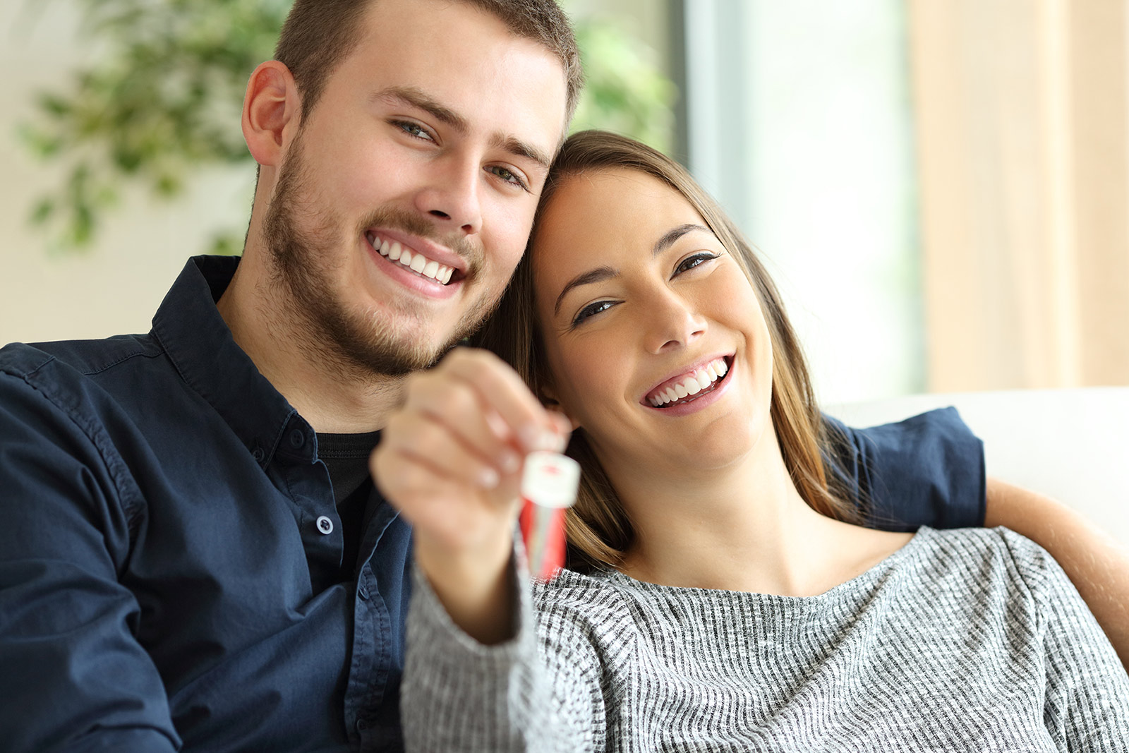 First home buyer couple smiling