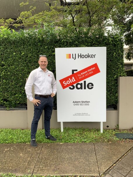 Sam Price, Brisbane Buyer's Agent from Templeton Property, outside a recent purchase, discussing Brisbane Property Prices.