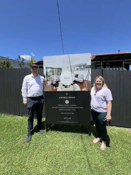 Picture of Brisbane Buyer's Agent Sam Price and a client outside of a house recently purchased. 
