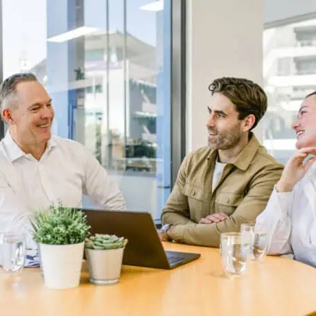 Sam Price from Templeton Property talking with clients about our auction bidding service in Brisbane