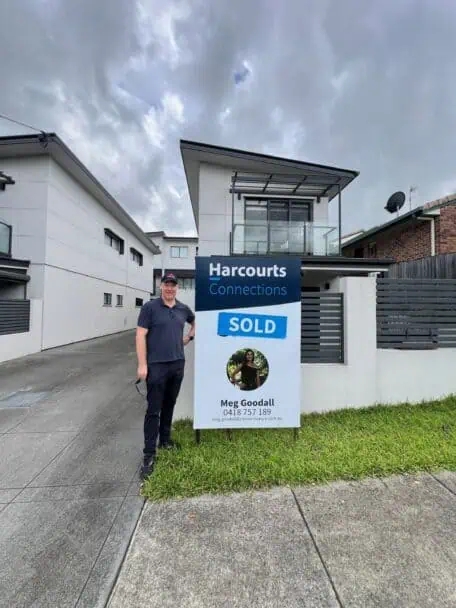 Buyer's agent Sam Price standing outside a property recently purchased for an investor in Brisbane. 