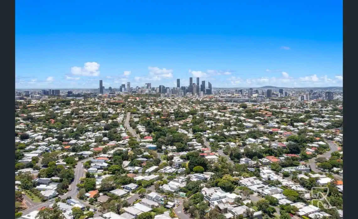 Aerial view across Red Hill rooftops to the Brisbane CBD, showing the inner west location of postcode 4059