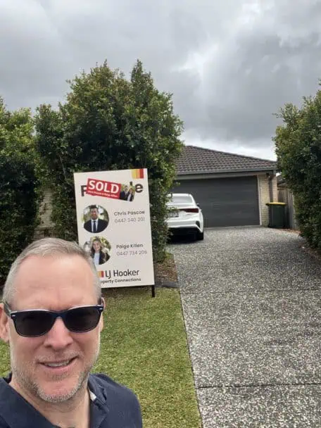 Sam Price, Brisbane Buyer's Agent and Registered Property Valuer, outside a home recently purchased for a client
